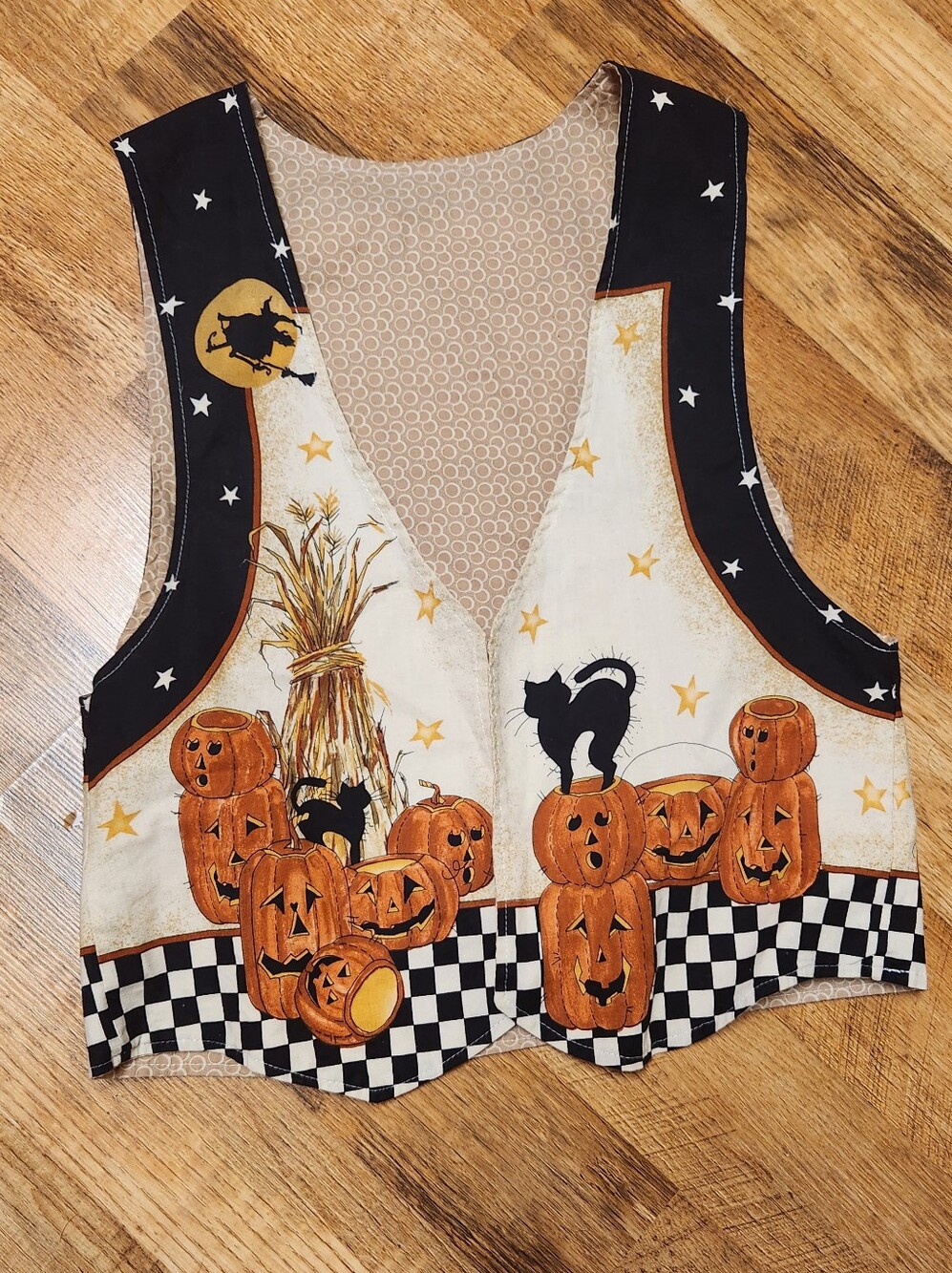 Halloween themed vest with pumpkins and witches, size s